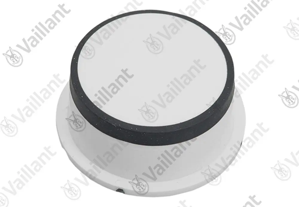 Weißer runder Knopf mit schwarzem Rand, wahrscheinlich für ein Gerät von Vaillant, auf neutralem Hintergrund.